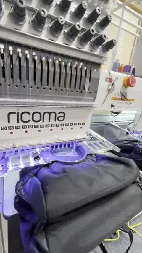 A bag positioned on the embroidery machine