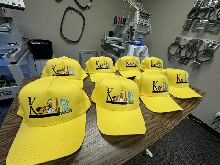 Yellow custom caps with embroidered front logos